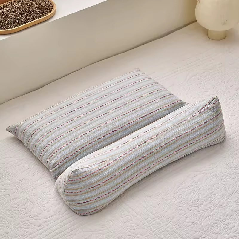 Light blue buckwheat hull triangle support pillow with roll
